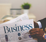 Man reading business newspaper